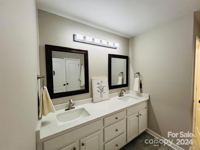 bathroom featuring tile patterned floors and vanity