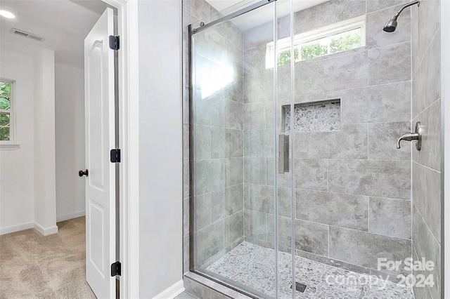 bathroom with an enclosed shower