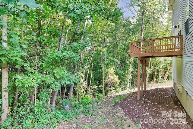 view of yard with a wooden deck