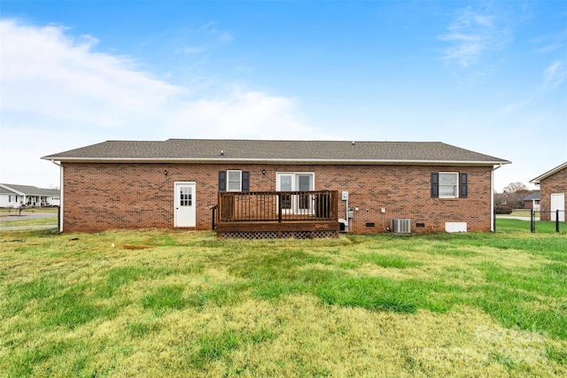 back of house featuring a lawn, central air condition unit, and a deck