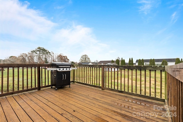 deck with a yard and grilling area