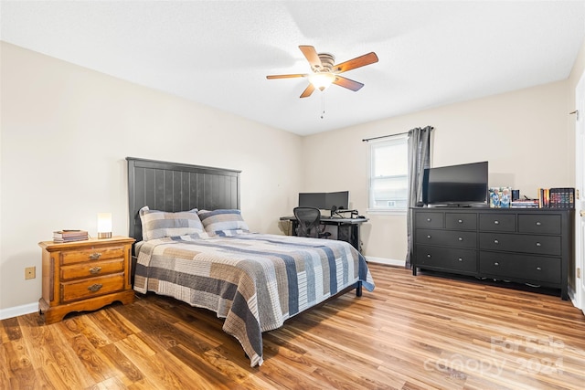 bedroom featuring ceiling fan and hardwood / wood-style floors