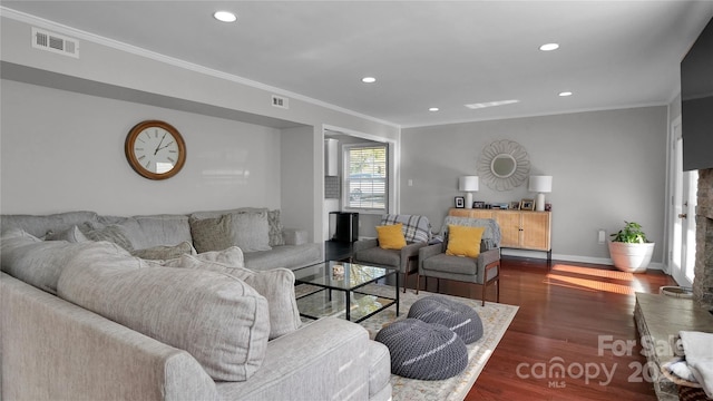 living room with dark hardwood / wood-style floors and ornamental molding