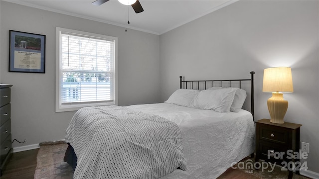 bedroom with ceiling fan, dark hardwood / wood-style floors, and crown molding