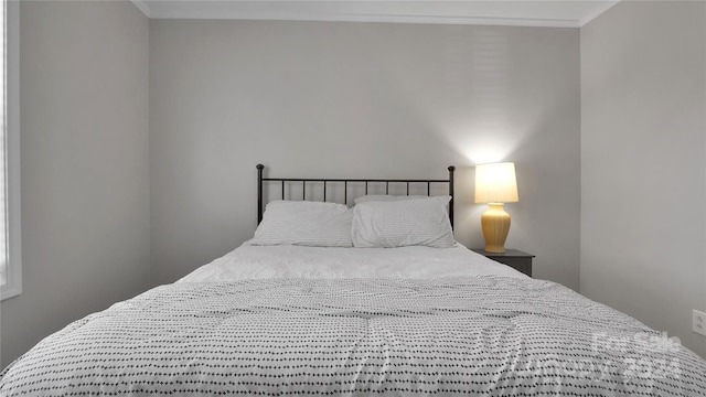 bedroom featuring crown molding