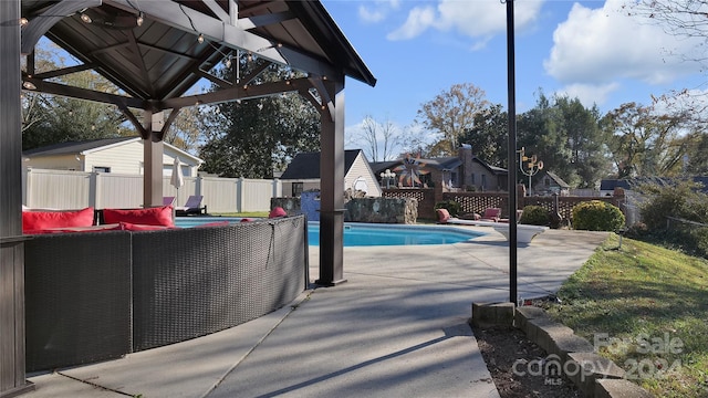 view of pool featuring a gazebo and a patio area