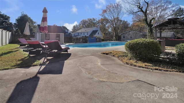 view of pool featuring a patio