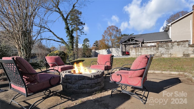 view of patio featuring an outdoor fire pit