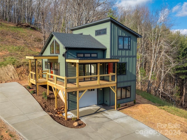 view of front facade featuring a garage and a deck