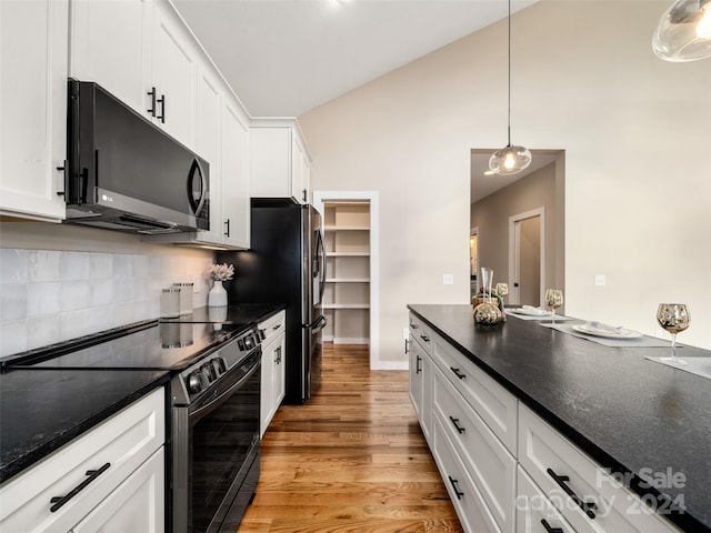 154 Aster Ridge Dr, Waynesville, NC 28786 - kitchen with appliances with stainless steel finishes, white cabinetry, tasteful backsplash, light wood-type flooring, and decorative light fixtures