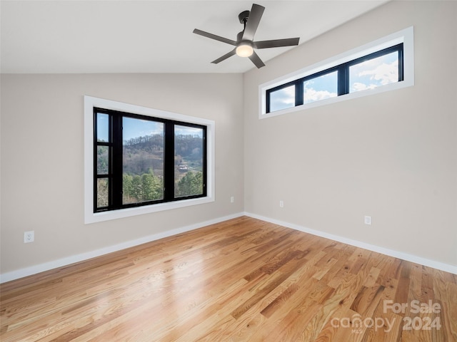 154 Aster Ridge Dr, Waynesville, NC 28786 - unfurnished room featuring lofted ceiling, wood finished floors, and ceiling fan