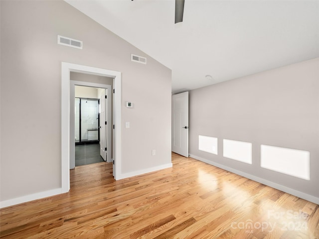 154 Aster Ridge Dr, Waynesville, NC 28786 - spare room with light wood finished floors, lofted ceiling, and ceiling fan