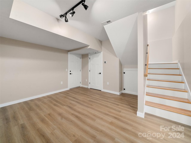 bonus room featuring light wood-type flooring