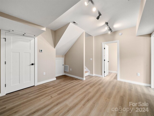 154 Aster Ridge Dr, Waynesville, NC 28786 - additional living space featuring light wood finished floors and stairway