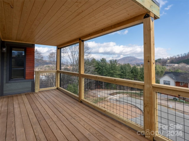 wooden terrace with a mountain view