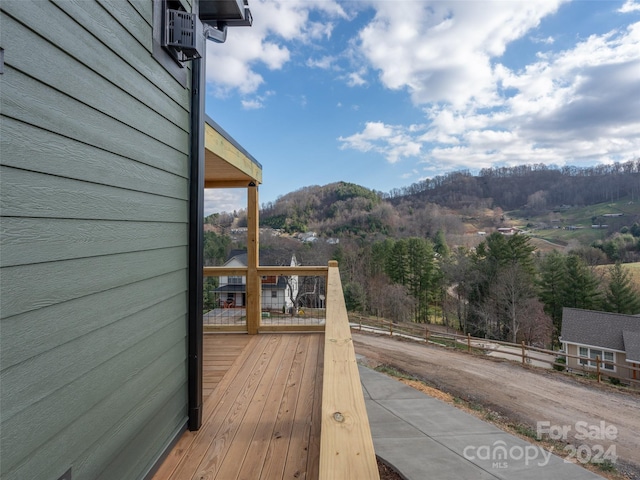 wooden deck with a mountain view