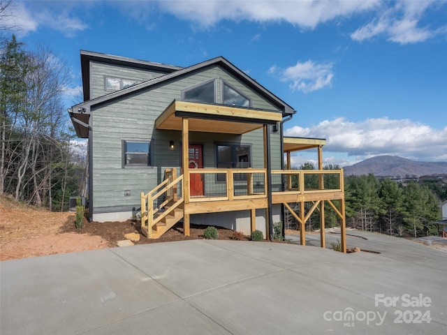154 Aster Ridge Dr, Waynesville, NC 28786 - view of front of house with a porch and a mountain view