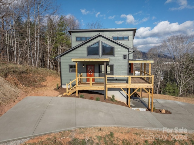 view of front of property featuring a wooden deck