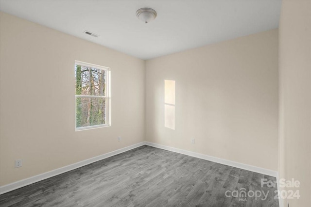 empty room featuring hardwood / wood-style flooring