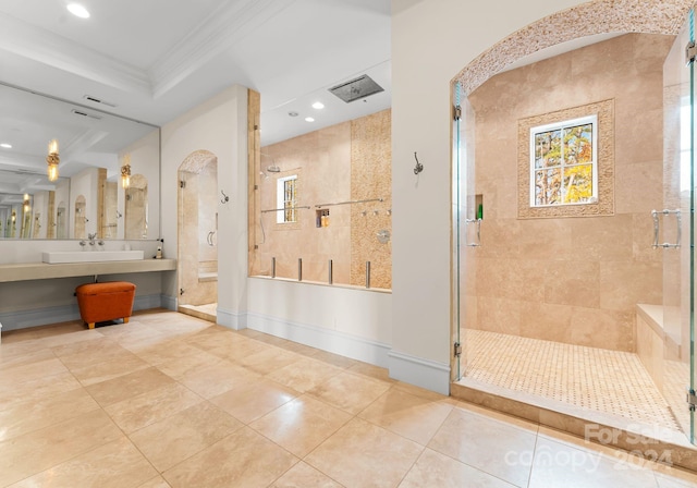 bathroom featuring an enclosed shower, ornamental molding, a raised ceiling, sink, and tile patterned flooring