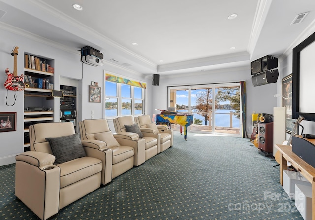 carpeted home theater room featuring plenty of natural light and ornamental molding