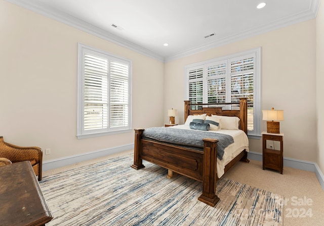 carpeted bedroom with crown molding