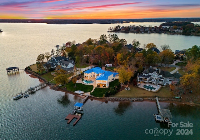 aerial view at dusk with a water view