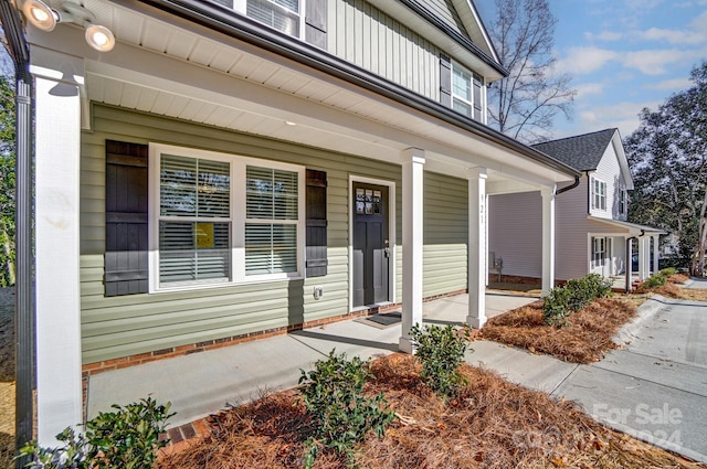 entrance to property with covered porch