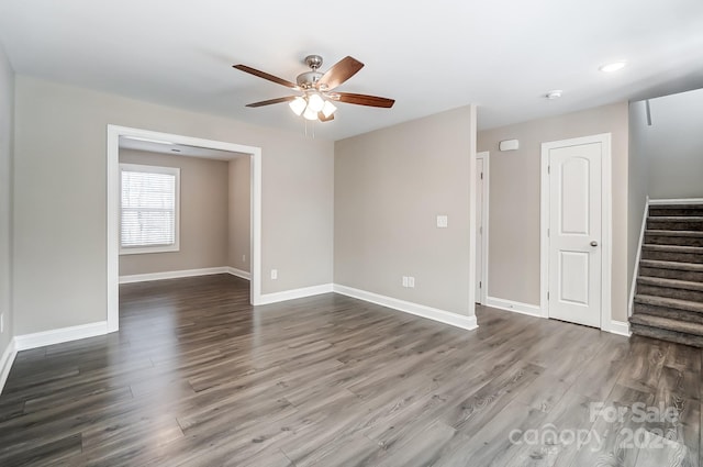 spare room featuring hardwood / wood-style floors and ceiling fan