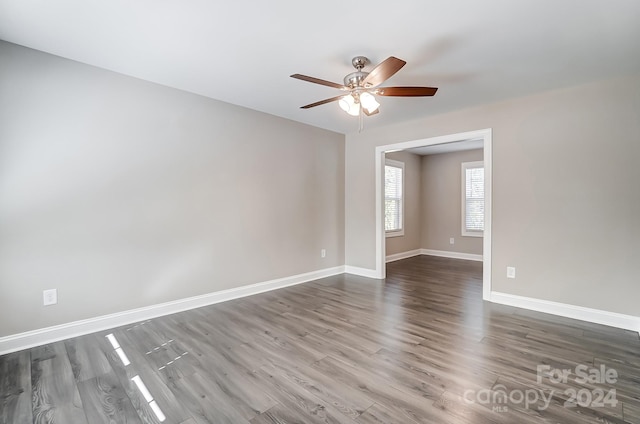 spare room featuring ceiling fan and hardwood / wood-style flooring