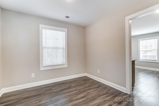 empty room featuring dark hardwood / wood-style floors