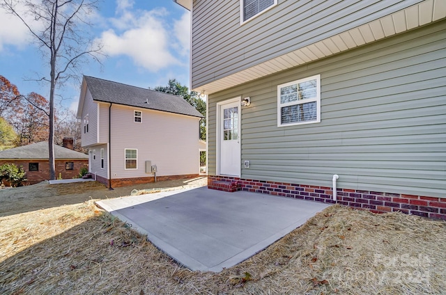 property entrance with a patio area