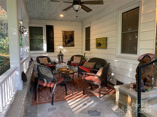 view of patio with outdoor lounge area, ceiling fan, and covered porch