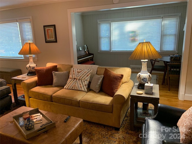 living room featuring ornamental molding and hardwood / wood-style flooring