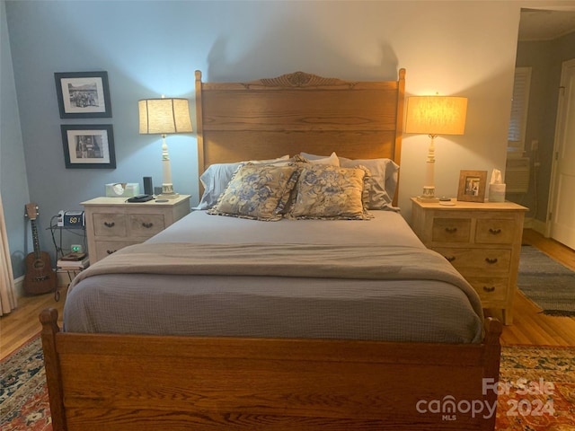 bedroom with light hardwood / wood-style flooring