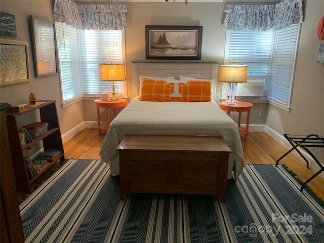 bedroom with light hardwood / wood-style floors