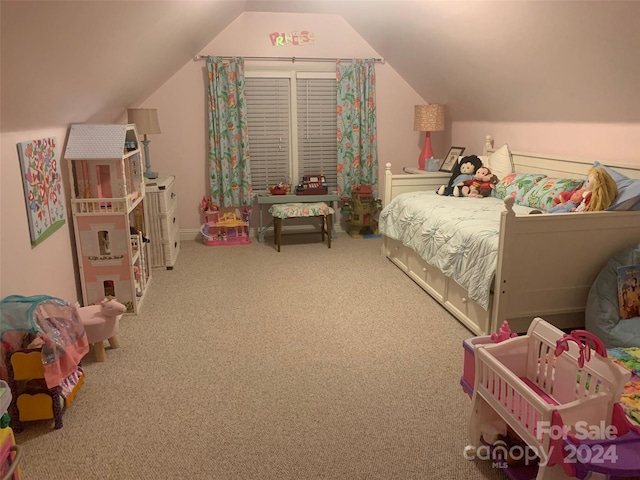 bedroom with carpet flooring and vaulted ceiling