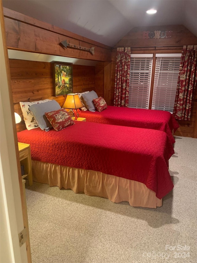 carpeted bedroom with vaulted ceiling