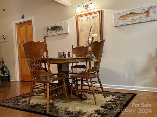 dining room with hardwood / wood-style flooring