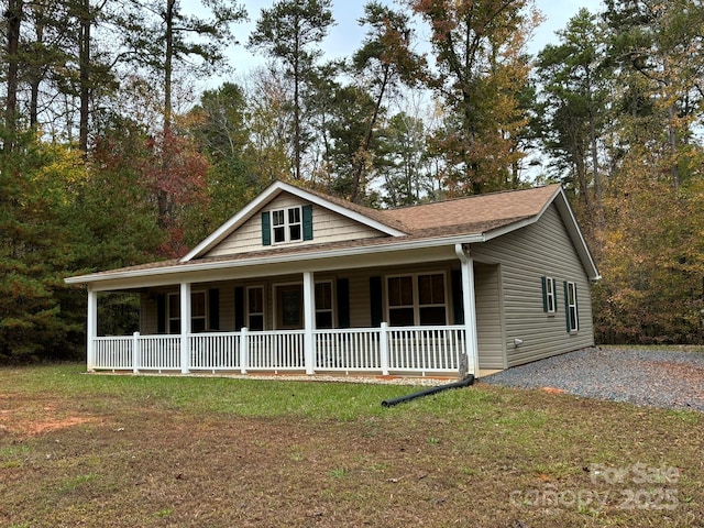 369 Pinecrest Cir, Troy, NC 27371 - view of front of home with a porch and a front lawn