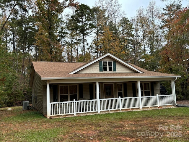 369 Pinecrest Cir, Troy, NC 27371 - view of front of property with covered porch, roof with shingles, and a front lawn