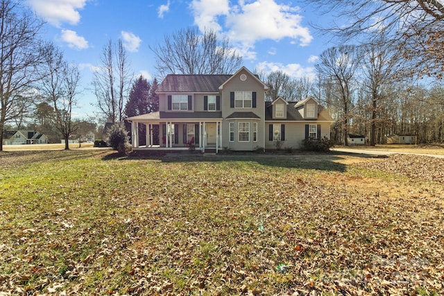 view of front of property featuring a front yard and a porch