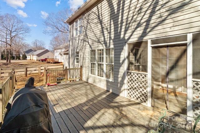 wooden terrace with area for grilling