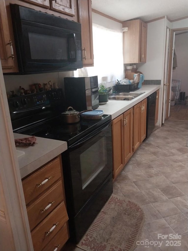 kitchen featuring sink and black appliances