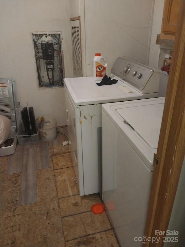 washroom featuring washer and clothes dryer