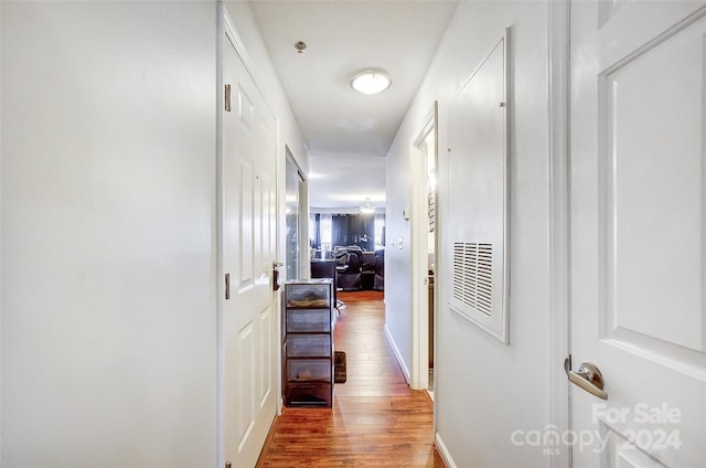 corridor featuring hardwood / wood-style floors