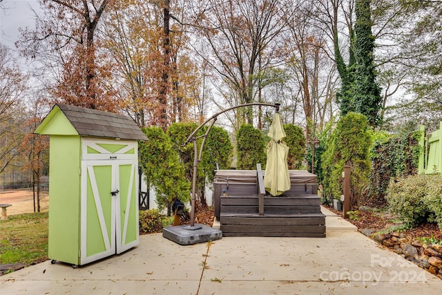 view of outbuilding featuring a hot tub