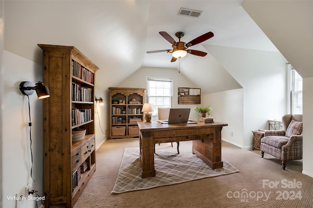 carpeted home office featuring ceiling fan and vaulted ceiling