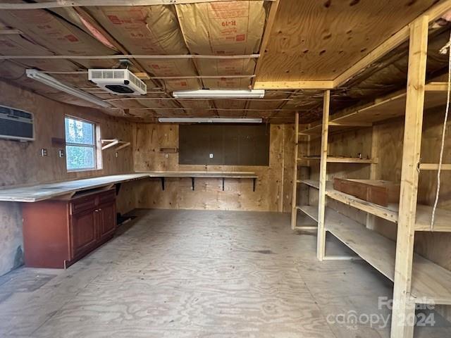 storage area with a wall mounted air conditioner