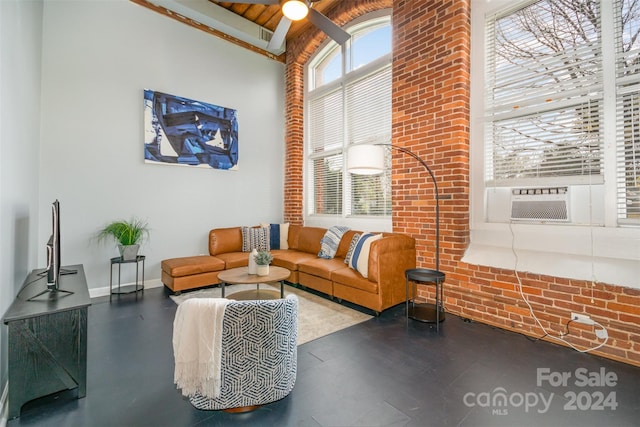 living room featuring ceiling fan, cooling unit, and lofted ceiling